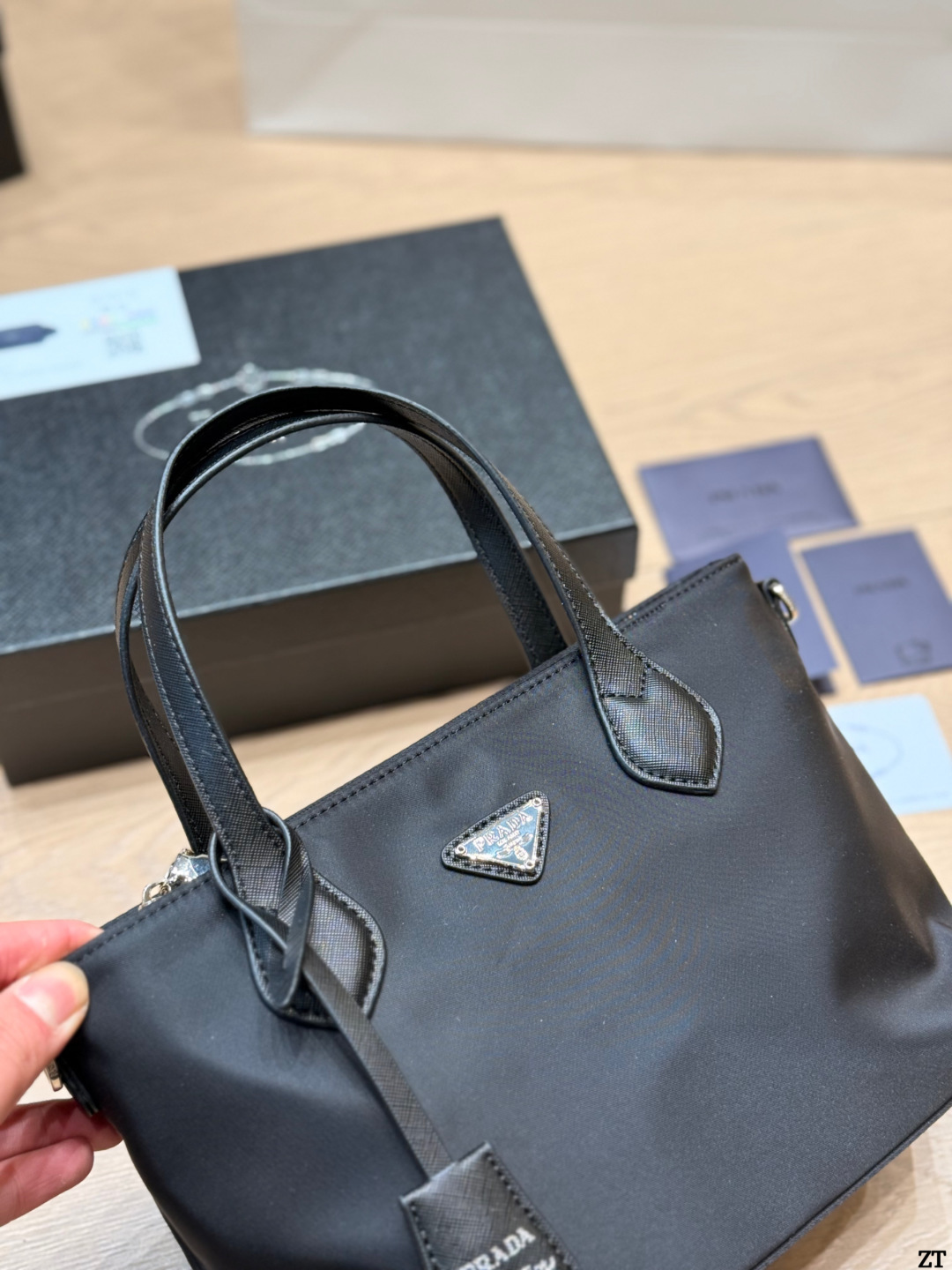 . Prada Nylon Handbag Prada’s classic nylon Handbag is made of iconic parachute - Image 11