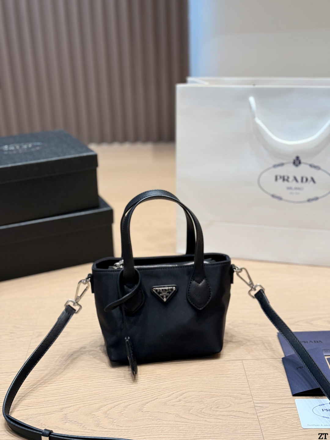 . Prada Nylon Handbag Prada’s classic nylon Handbag is made of iconic parachute - Image 6