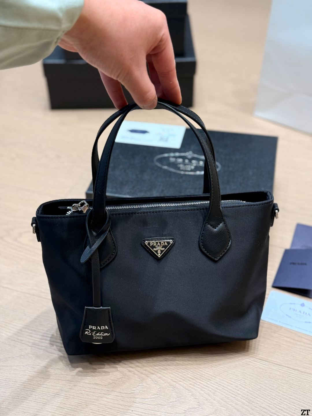 . Prada Nylon Handbag Prada’s classic nylon Handbag is made of iconic parachute - Image 9